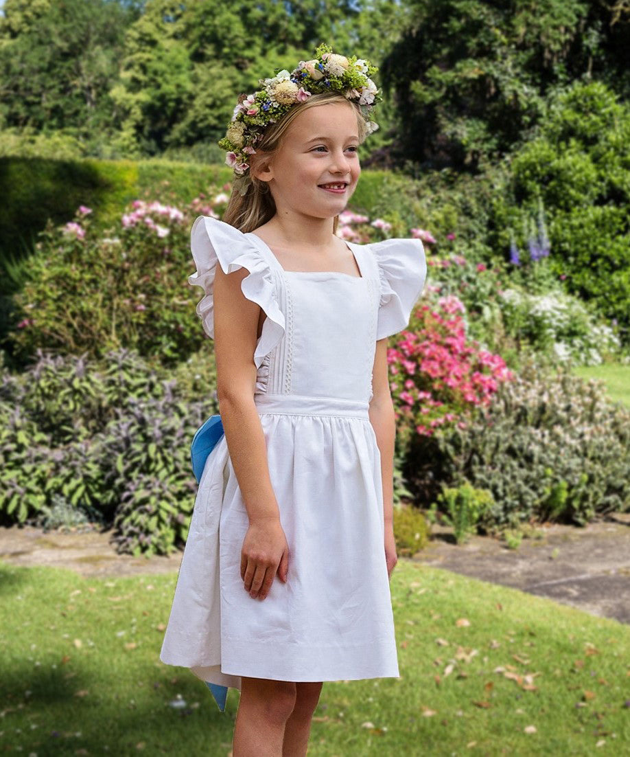 Ruffle cross-strap flower girl dress in ivory and blue by Amelia Brennan Weddings