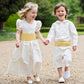Ivory silk bridesmaid and pageboy outfit with Yellow Sashes by Amelia Brennan Weddings