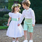 White and pale green linen pageboy and bridesmaid outfits by Amelia Brennan Weddings