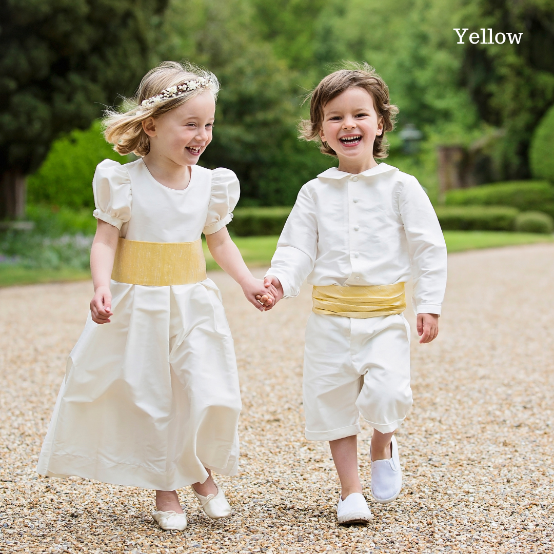 Pageboy wearing yellow silk cummerbunds by Amelia Brennan