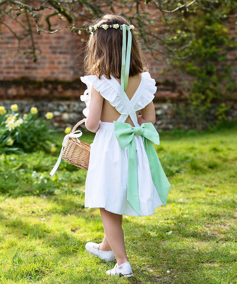 Linen Cross-Back Ruffle Flower Girl Dress with Green Bow by Amelia Brennan