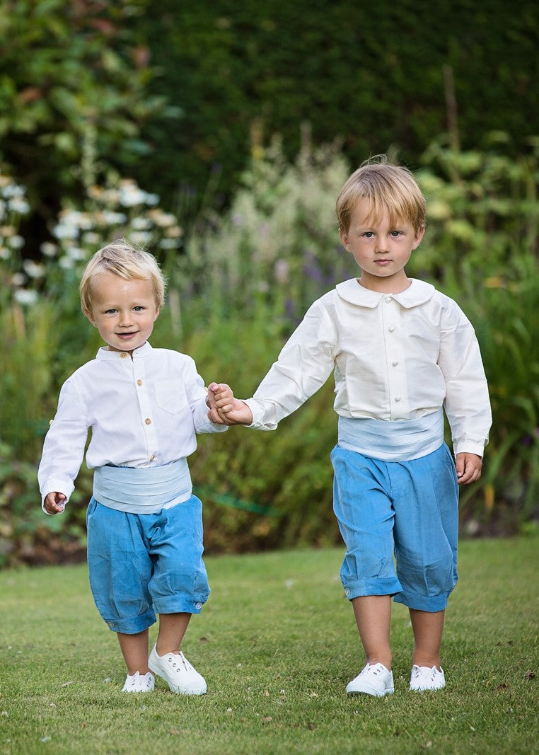 Pageboys wear White Cienta Laceless pumps stocked by Amelia Brennan Weddings