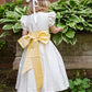 Ivory silk flower girl dress with long yellow sash