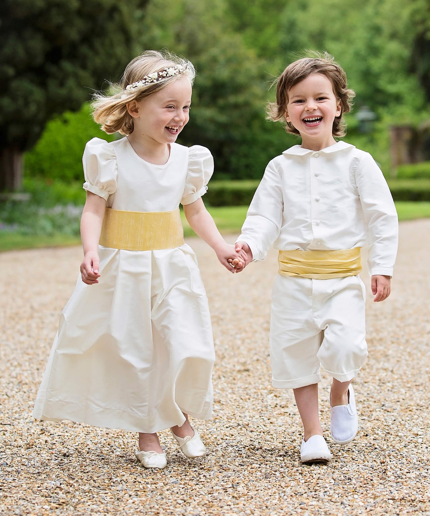 Ivory silk bridesmaid and pageboy outfit with Yellow Sashes by Amelia Brennan Weddings
