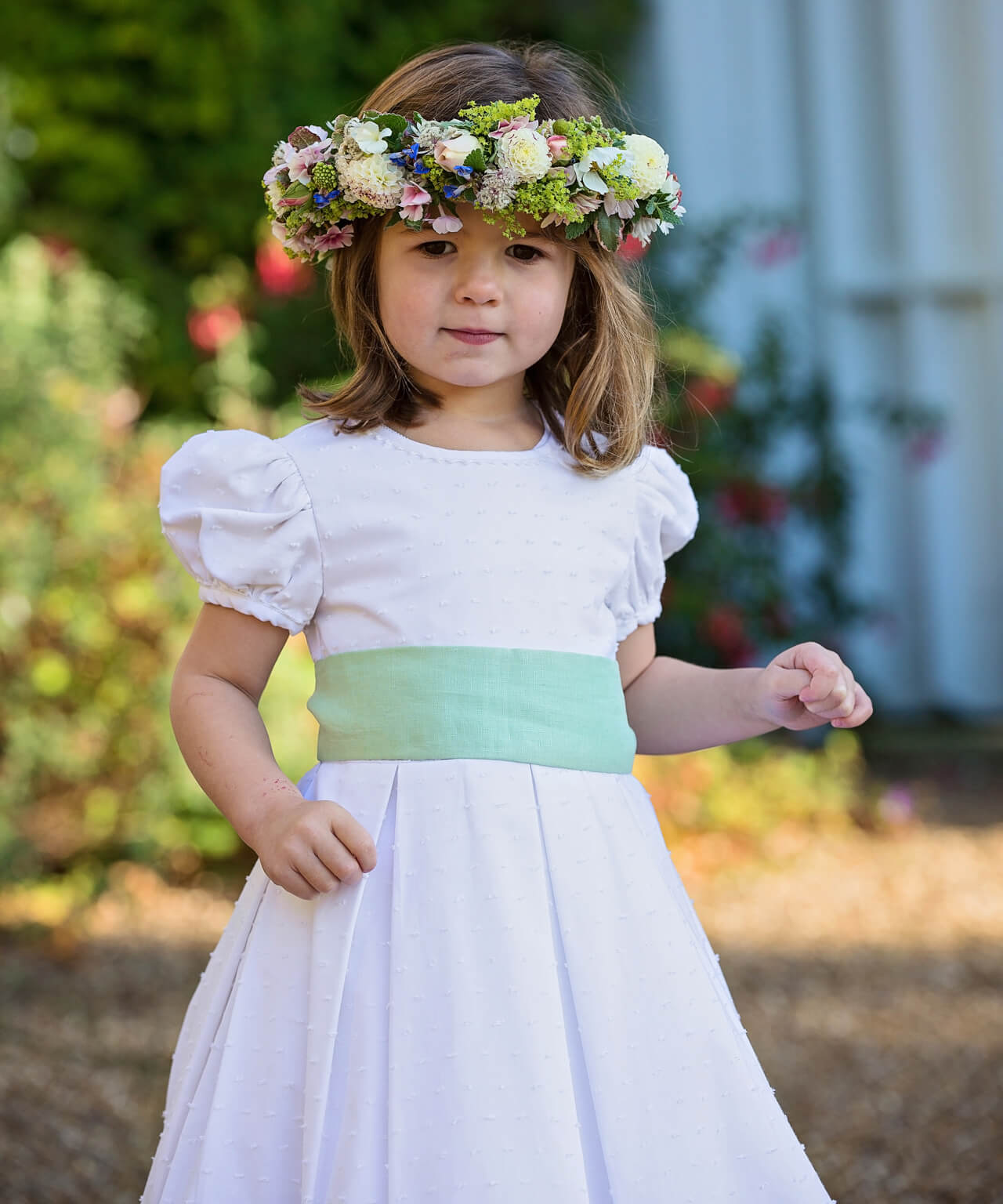 White Dot Cotton Flower Girl Dress with Green Sash by Amelia Brennan Weddings