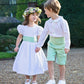 White and green linen pageboy and bridesmaids outfits by Amelia Brennan Weddings
